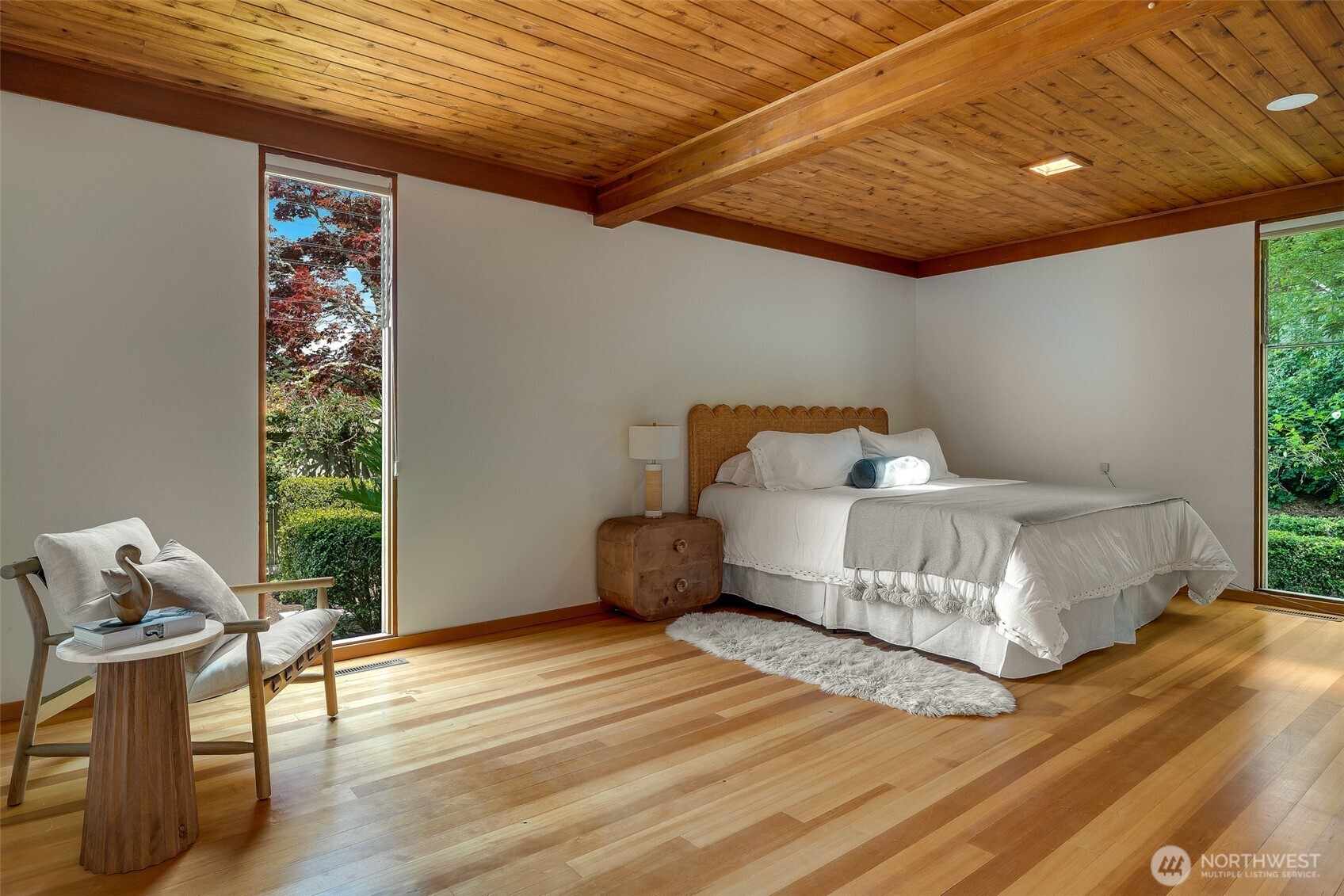 615 Bayside Road Bellingham, WA 98225 - Photo 21 of 31 a bedroom with a bed and wooden floor