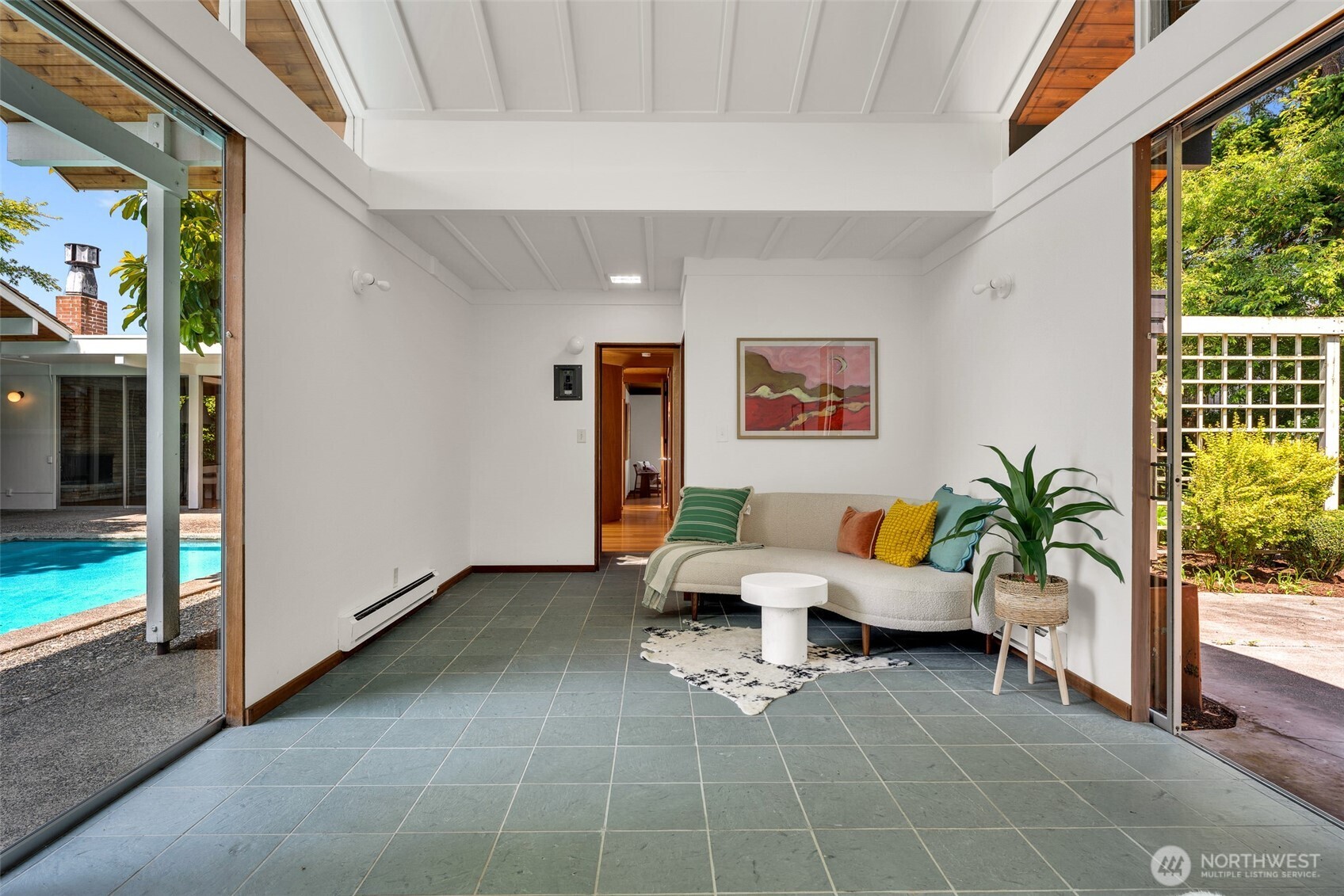 615 Bayside Road Bellingham, WA 98225 - Photo 23 of 31 a living room with furniture and a potted plant