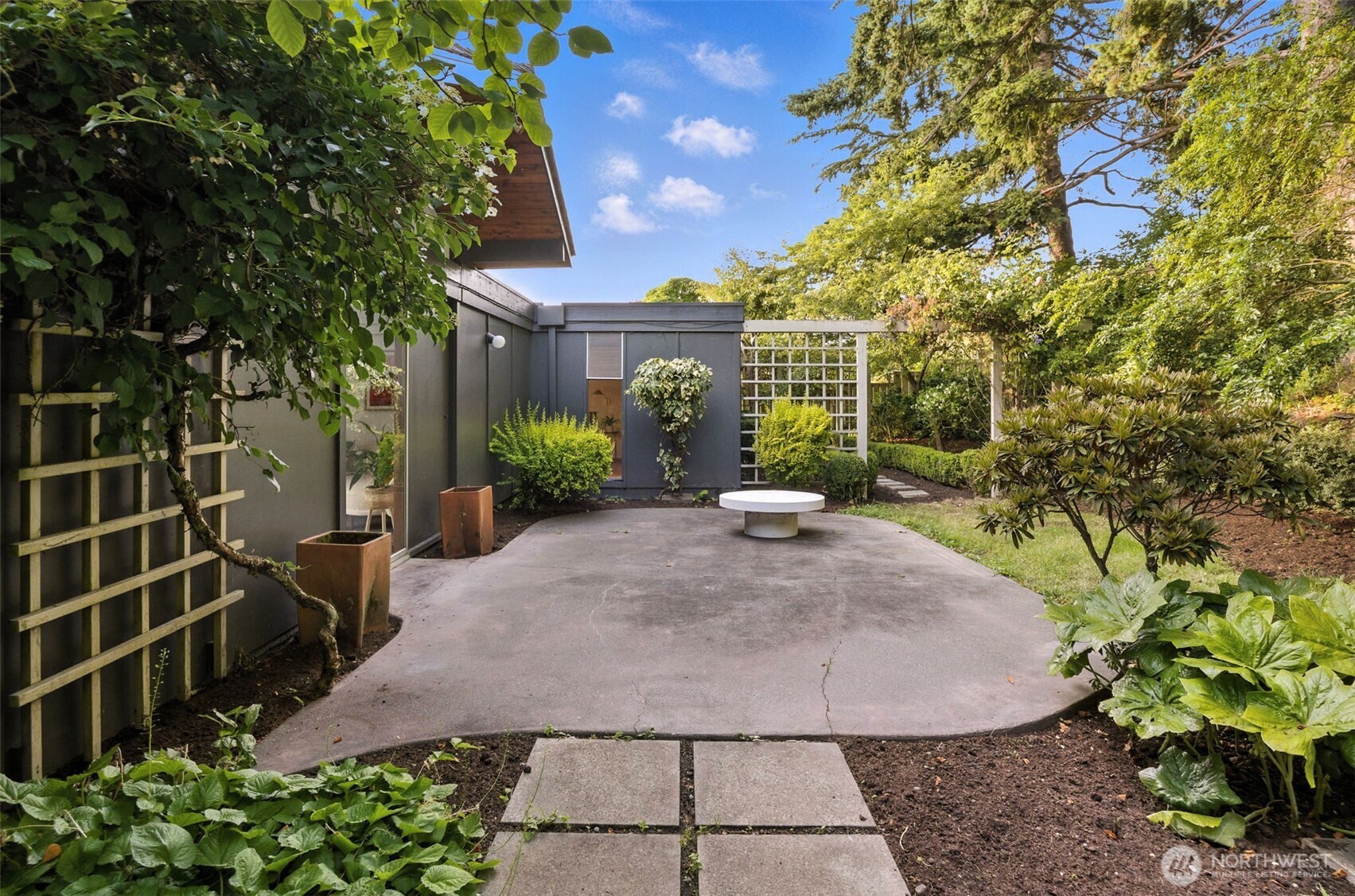 615 Bayside Road Bellingham, WA 98225 - Photo 28 of 31 a view of a yard with plants and a fountain