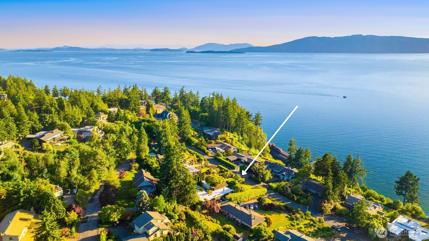615 Bayside Road Bellingham, WA 98225 - Photo 3 of 31 a view of a field with an ocean in the background