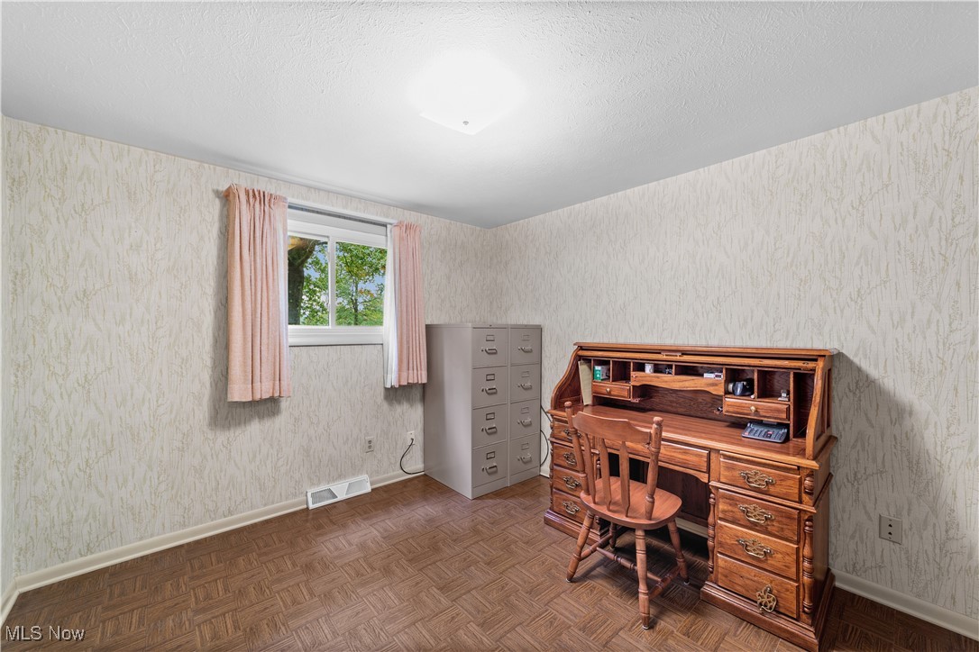 648 Rehwinkle Road Northfield, OH 44067 - Photo 19 of 38 Bedroom / office space with wallpapered walls and a textured ceiling