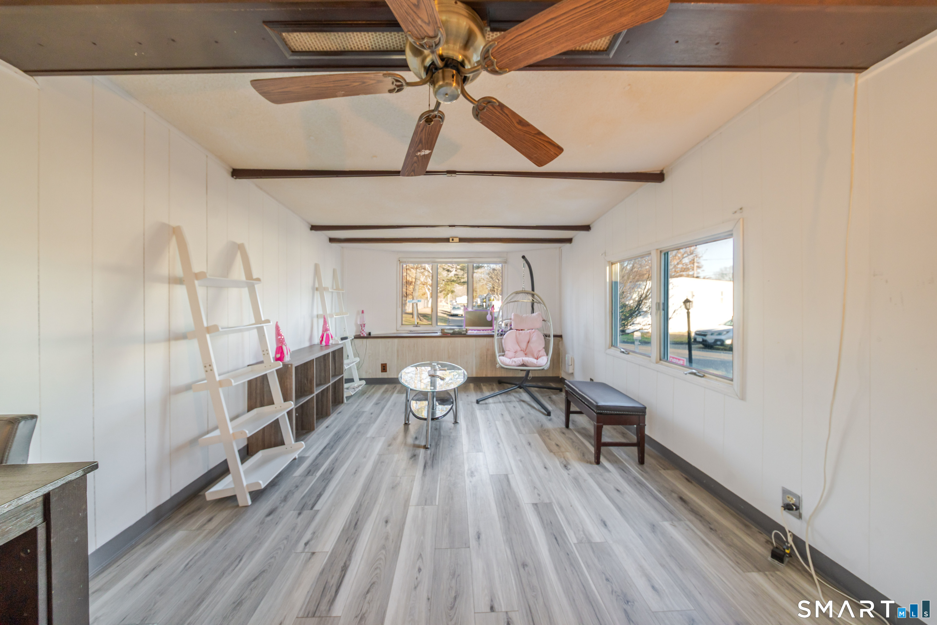 93 Shawnee Road East Hartford, CT 06118 - Photo 7 of 37 a workspace with wooden floor and windows