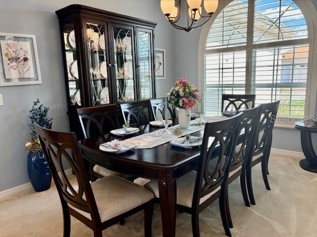 6261 Pinehurst Loop Winter Haven, FL 33884 - Photo 14 of 76 a view of a dining room with furniture window and outside view