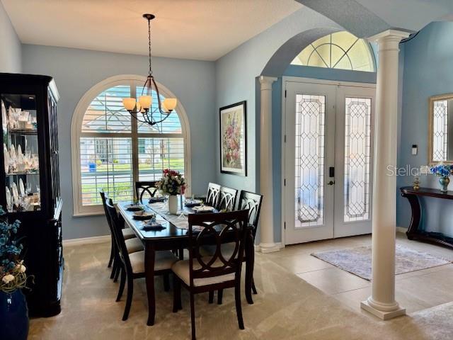 6261 Pinehurst Loop Winter Haven, FL 33884 - Photo 15 of 76 a view of a dining room with furniture window and wooden floor