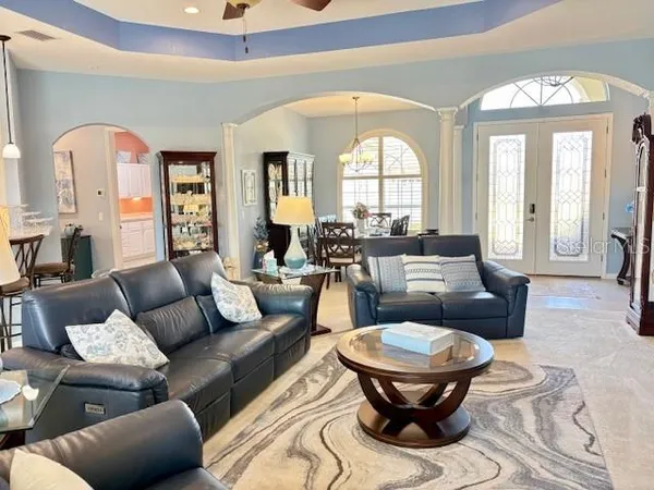 a dining room with furniture and window