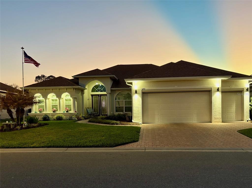 6261 Pinehurst Loop Winter Haven, FL 33884 - Photo 2 of 76 a front view of a house with a yard
