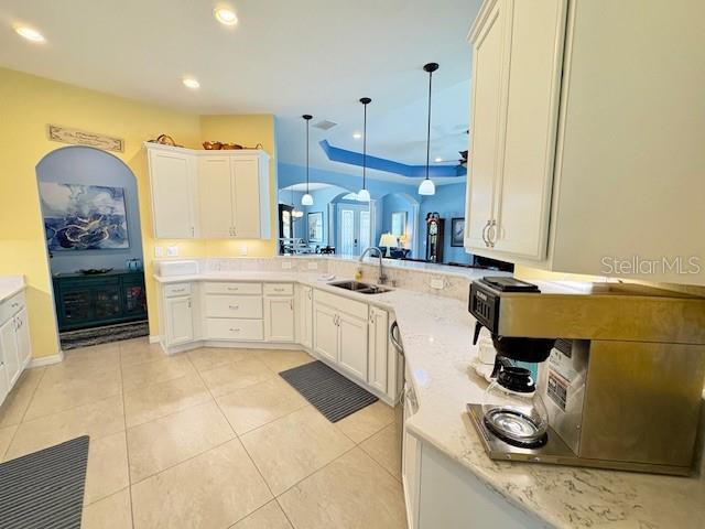 6261 Pinehurst Loop Winter Haven, FL 33884 - Photo 26 of 76 a kitchen with a sink appliances and cabinets