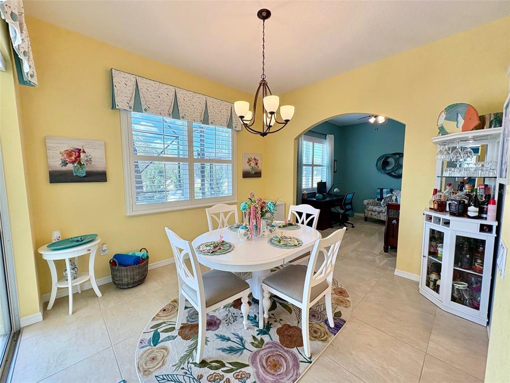 6261 Pinehurst Loop Winter Haven, FL 33884 - Photo 29 of 76 a dining room with furniture and window