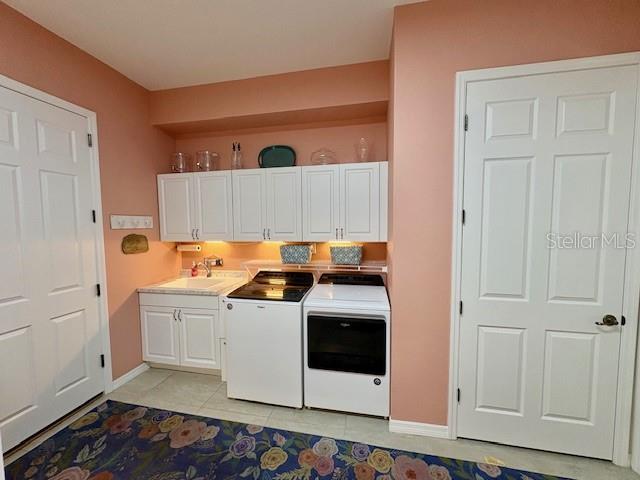 6261 Pinehurst Loop Winter Haven, FL 33884 - Photo 33 of 76 a kitchen with stainless steel appliances granite countertop a stove and a white cabinets