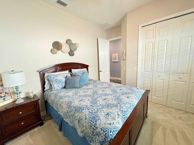 6261 Pinehurst Loop Winter Haven, FL 33884 - Photo 37 of 76 a bedroom with a bed and a window