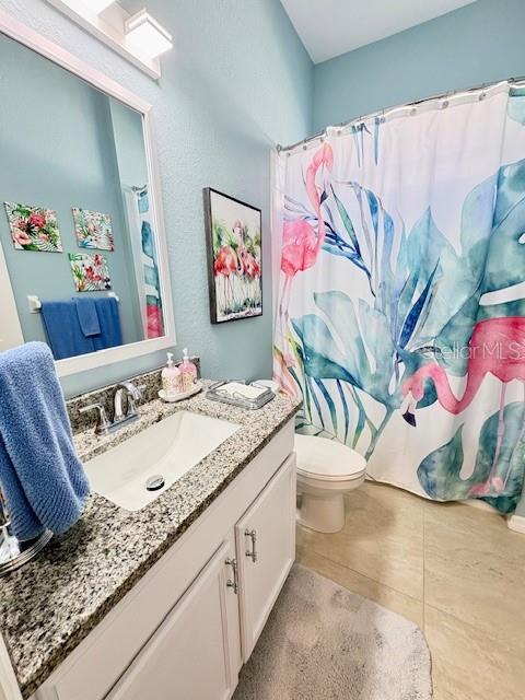 6261 Pinehurst Loop Winter Haven, FL 33884 - Photo 41 of 76 a bathroom with a granite countertop sink and a mirror