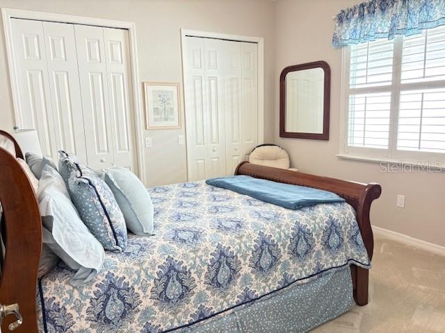 6261 Pinehurst Loop Winter Haven, FL 33884 - Photo 43 of 76 a bedroom with a bed and a window