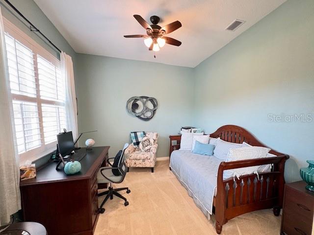6261 Pinehurst Loop Winter Haven, FL 33884 - Photo 45 of 76 a living room with furniture and a large window