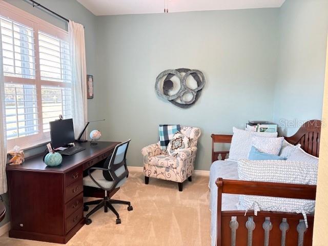 6261 Pinehurst Loop Winter Haven, FL 33884 - Photo 47 of 76 a view of a workspace with furniture and a window