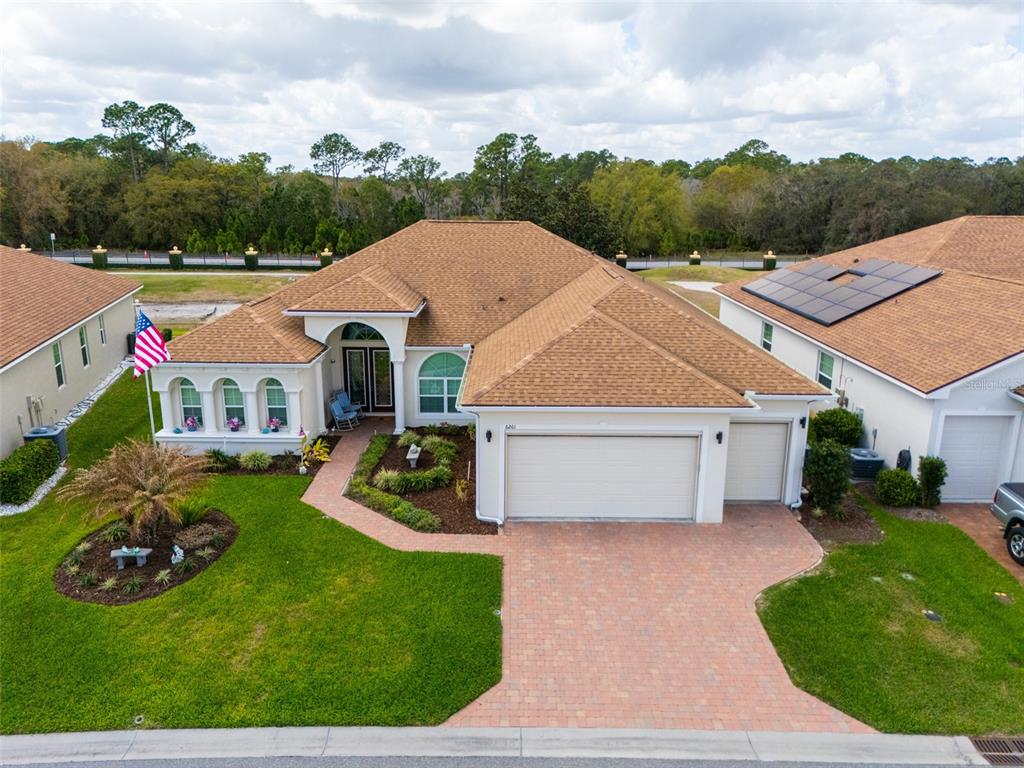 6261 Pinehurst Loop Winter Haven, FL 33884 - Photo 70 of 76 a aerial view of a house with garden