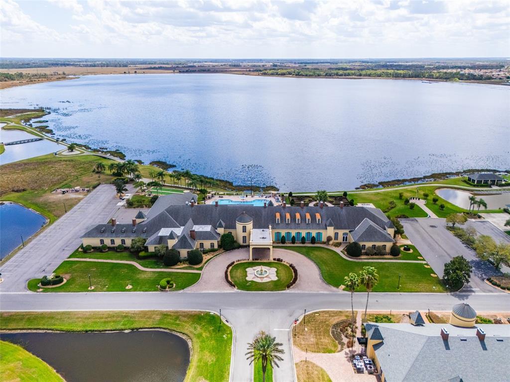6261 Pinehurst Loop Winter Haven, FL 33884 - Photo 76 of 76 an aerial view of residential houses with outdoor space and swimming pool