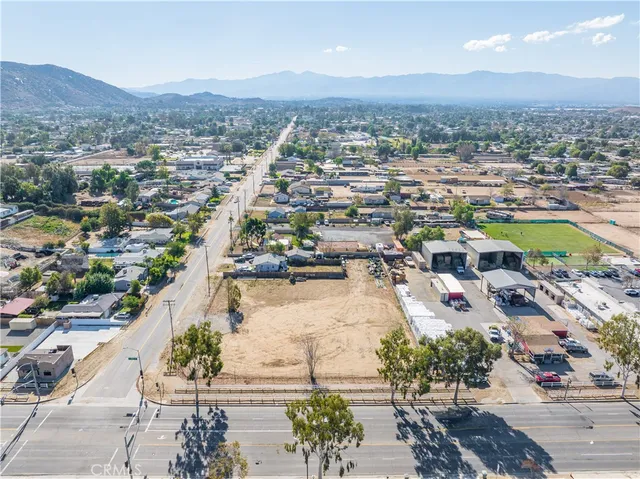 an aerial view of residential house and sandy dunes