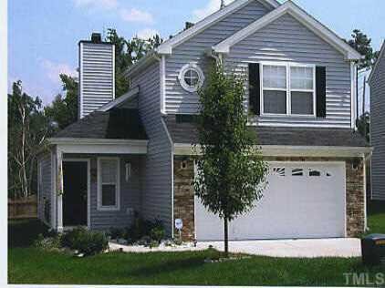 4720 Tommans Trail Raleigh, NC 27616 - Photo 1 of 1 a front view of a house with a garden