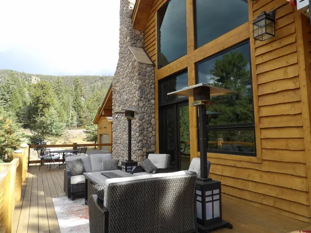 a outdoor living space with patio furniture and garden view