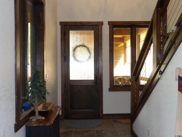 a view of living room with furniture and a window