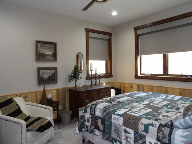 a bedroom with a bed and window