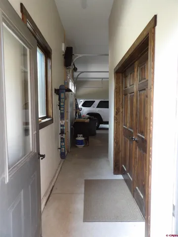 a view of hallway with furniture
