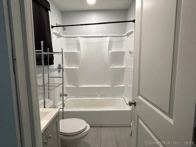 a bathroom with a shower and a toilet