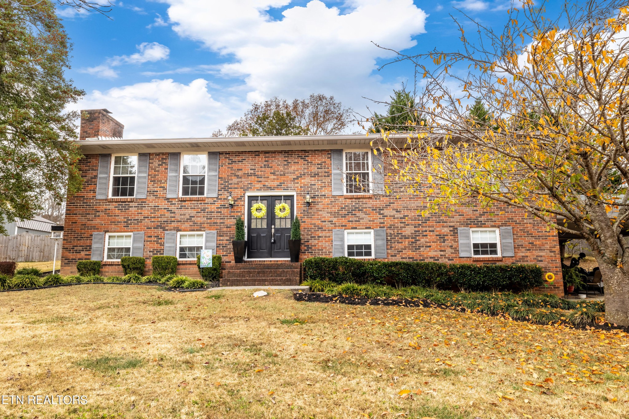 a front view of a house with a yard