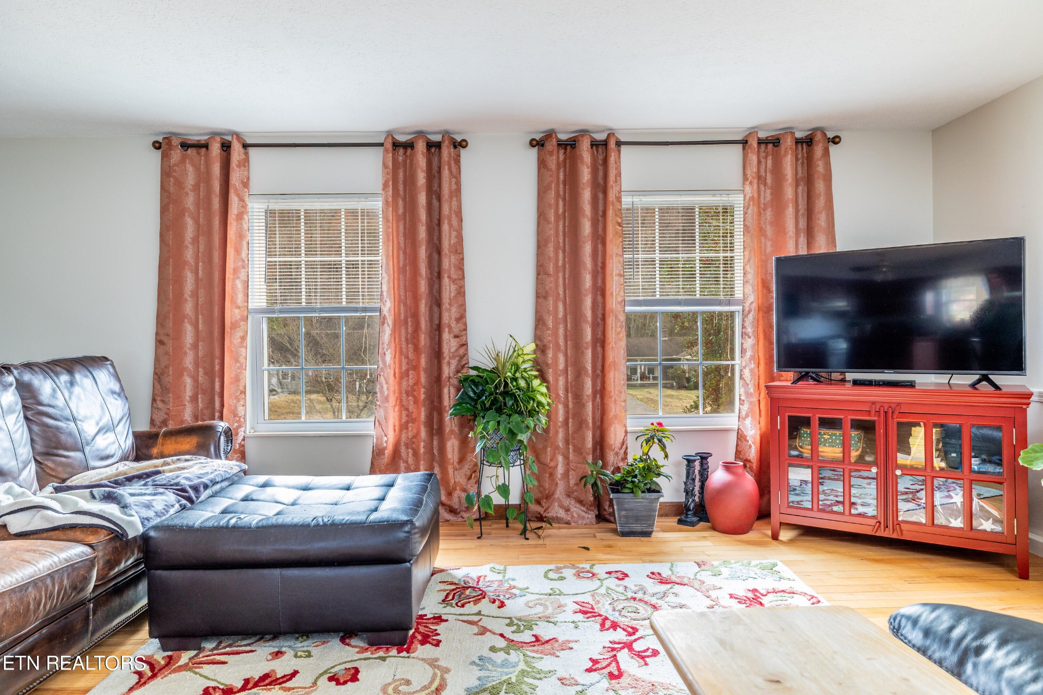 625 Riverbend Road Clinton, TN 37716 - Photo 12 of 45 a living room with furniture and a flat screen tv