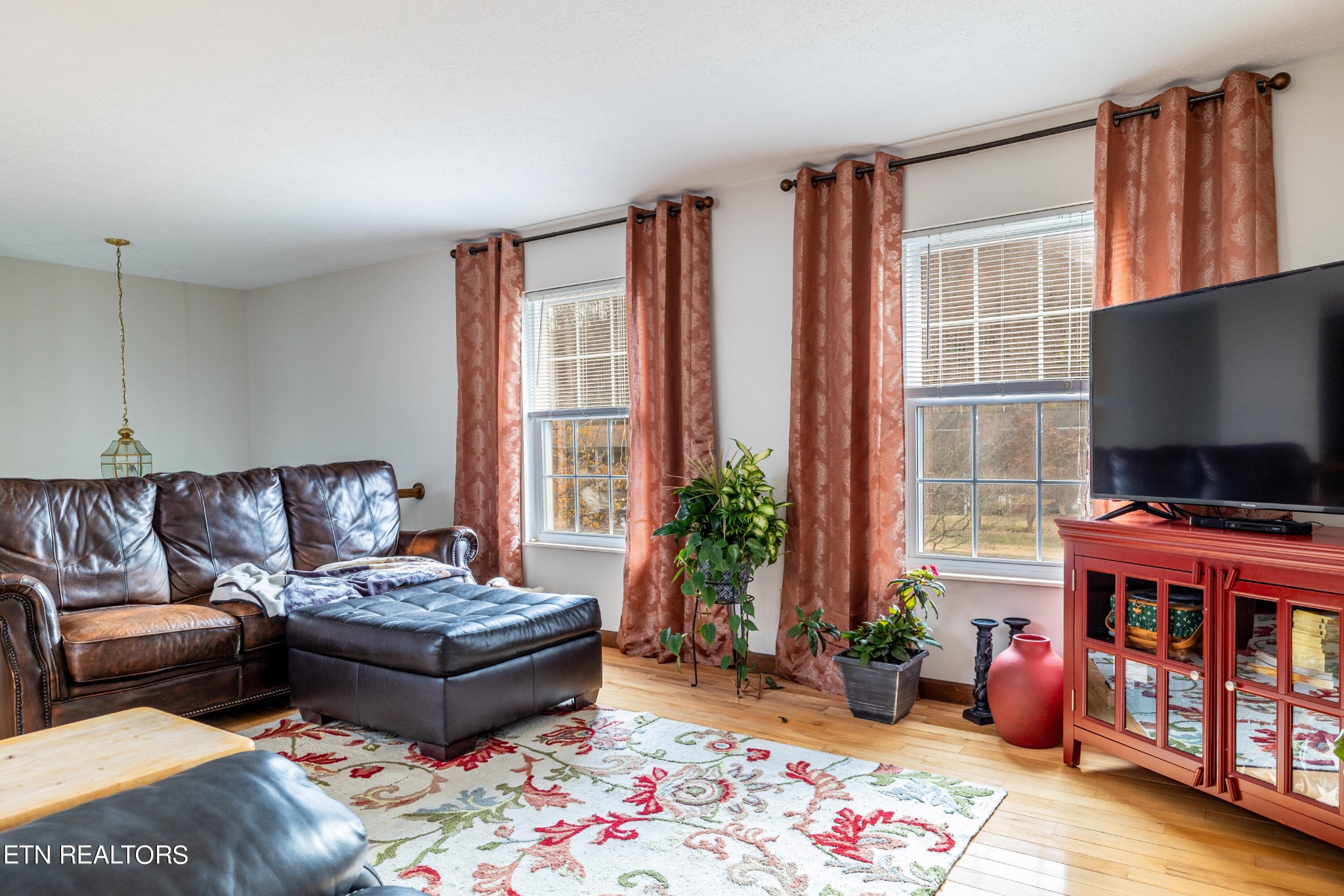 625 Riverbend Road Clinton, TN 37716 - Photo 13 of 45 a living room with furniture and a flat screen tv