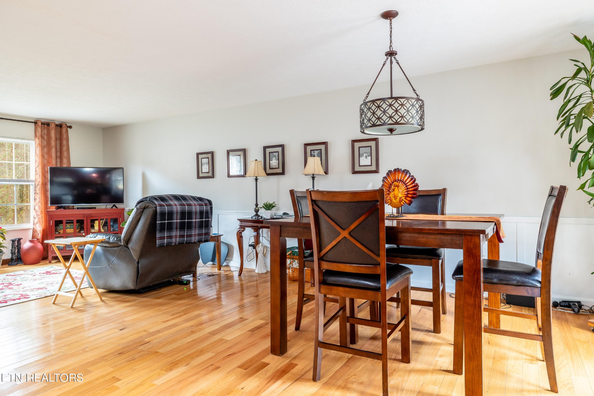 625 Riverbend Road Clinton, TN 37716 - Photo 21 of 45 a dining room with furniture a chandelier and wooden floor