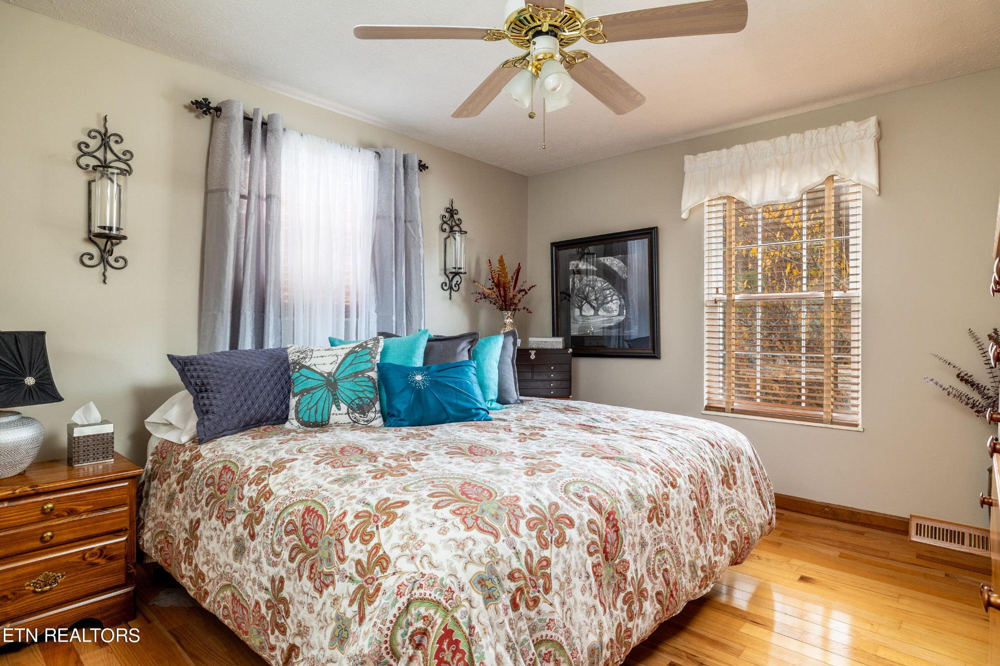 625 Riverbend Road Clinton, TN 37716 - Photo 24 of 45 a bedroom with a large bed and a chandelier