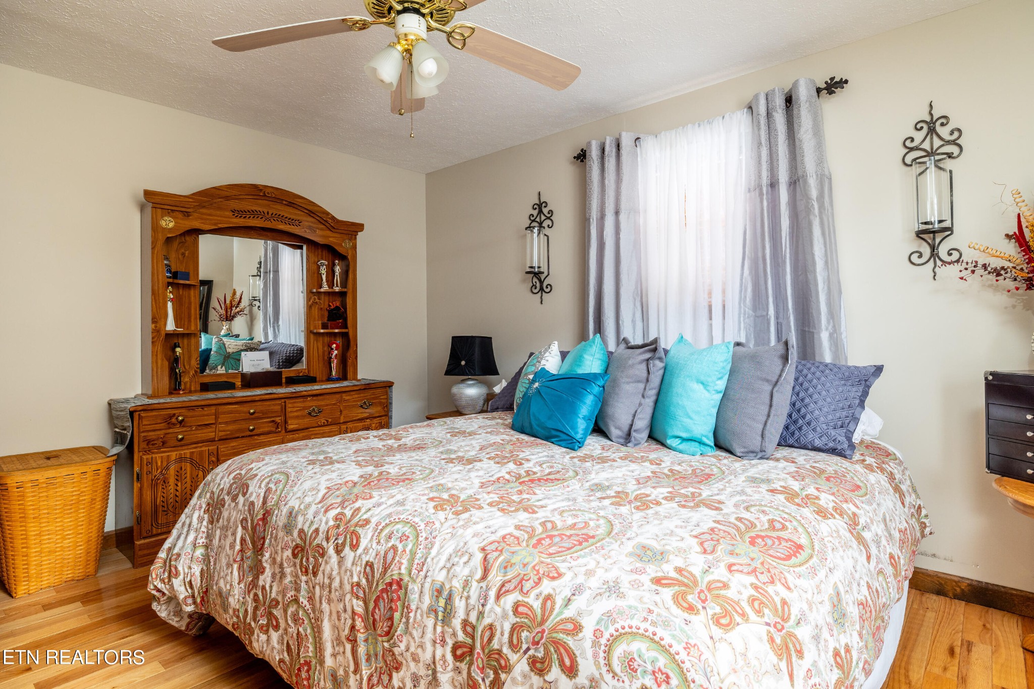 625 Riverbend Road Clinton, TN 37716 - Photo 25 of 45 a bedroom with a large bed and a chandelier