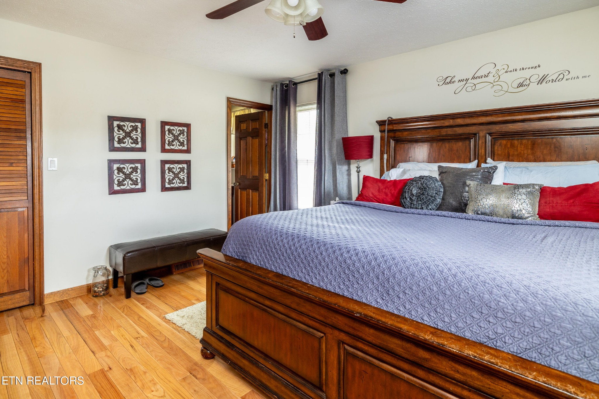 625 Riverbend Road Clinton, TN 37716 - Photo 29 of 45 a bedroom with a bed and wooden floor