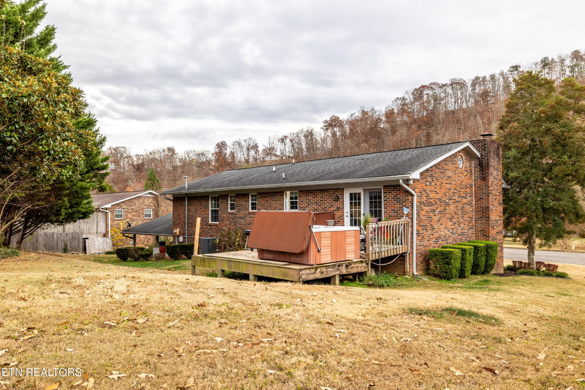 625 Riverbend Road Clinton, TN 37716 - Photo 5 of 45 a front view of a house with a yard and garage