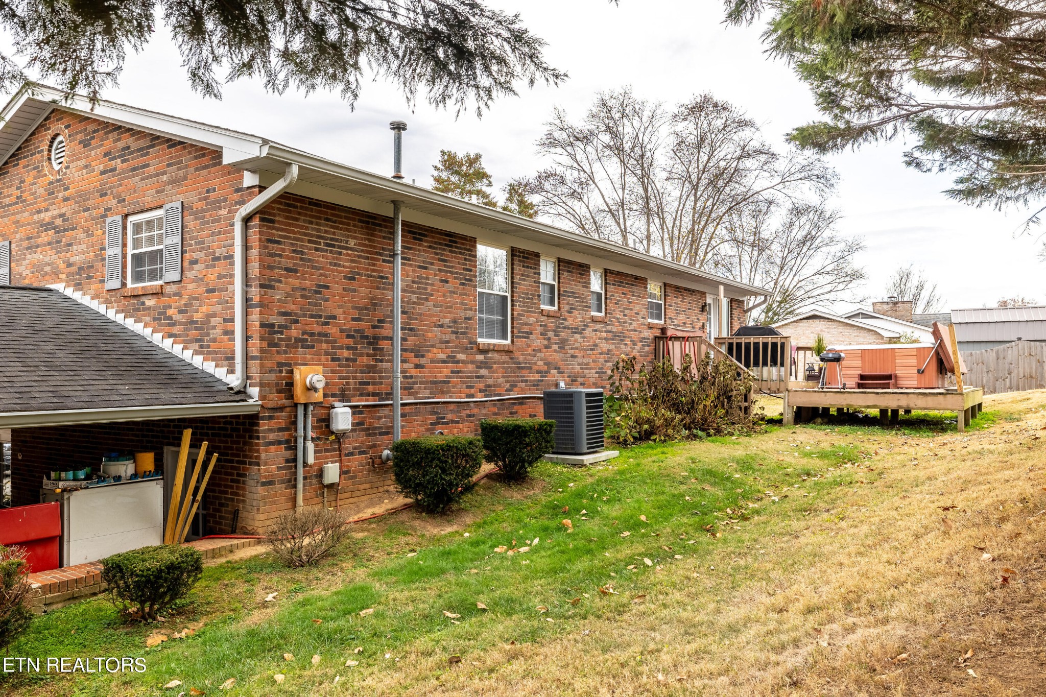 625 Riverbend Road Clinton, TN 37716 - Photo 6 of 45 a front view of a house with a yard and garage