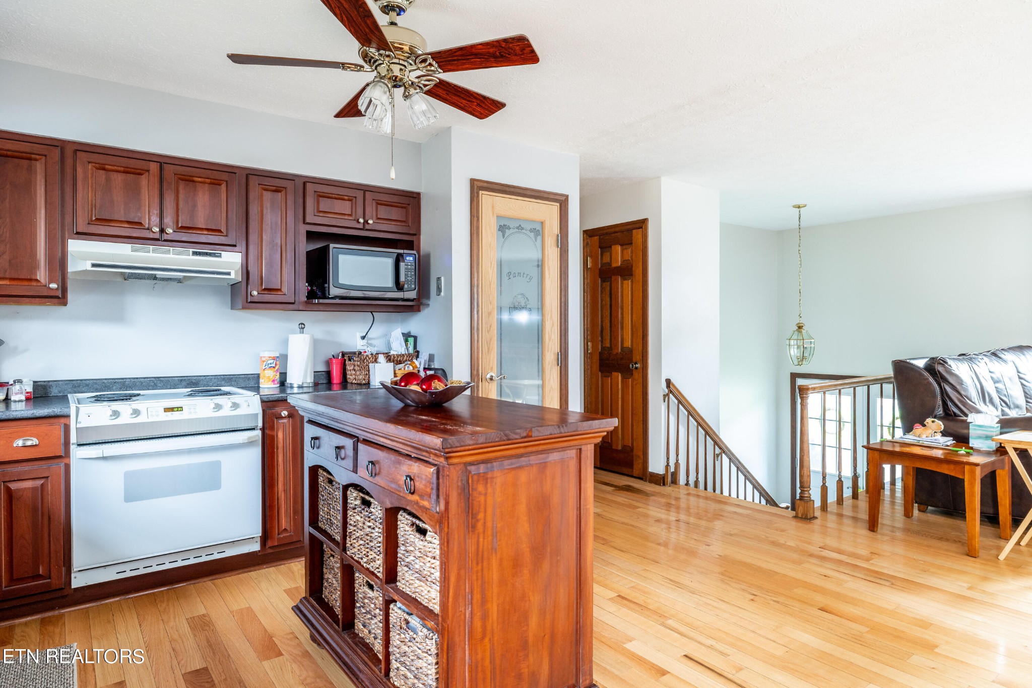 625 Riverbend Road Clinton, TN 37716 - Photo 10 of 45 a kitchen with stainless steel appliances granite countertop a stove cabinets and wooden floor