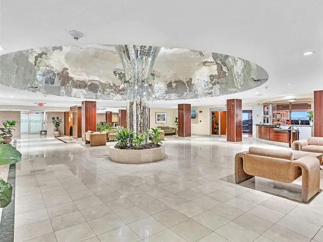 a view of a livingroom with furniture and chandelier