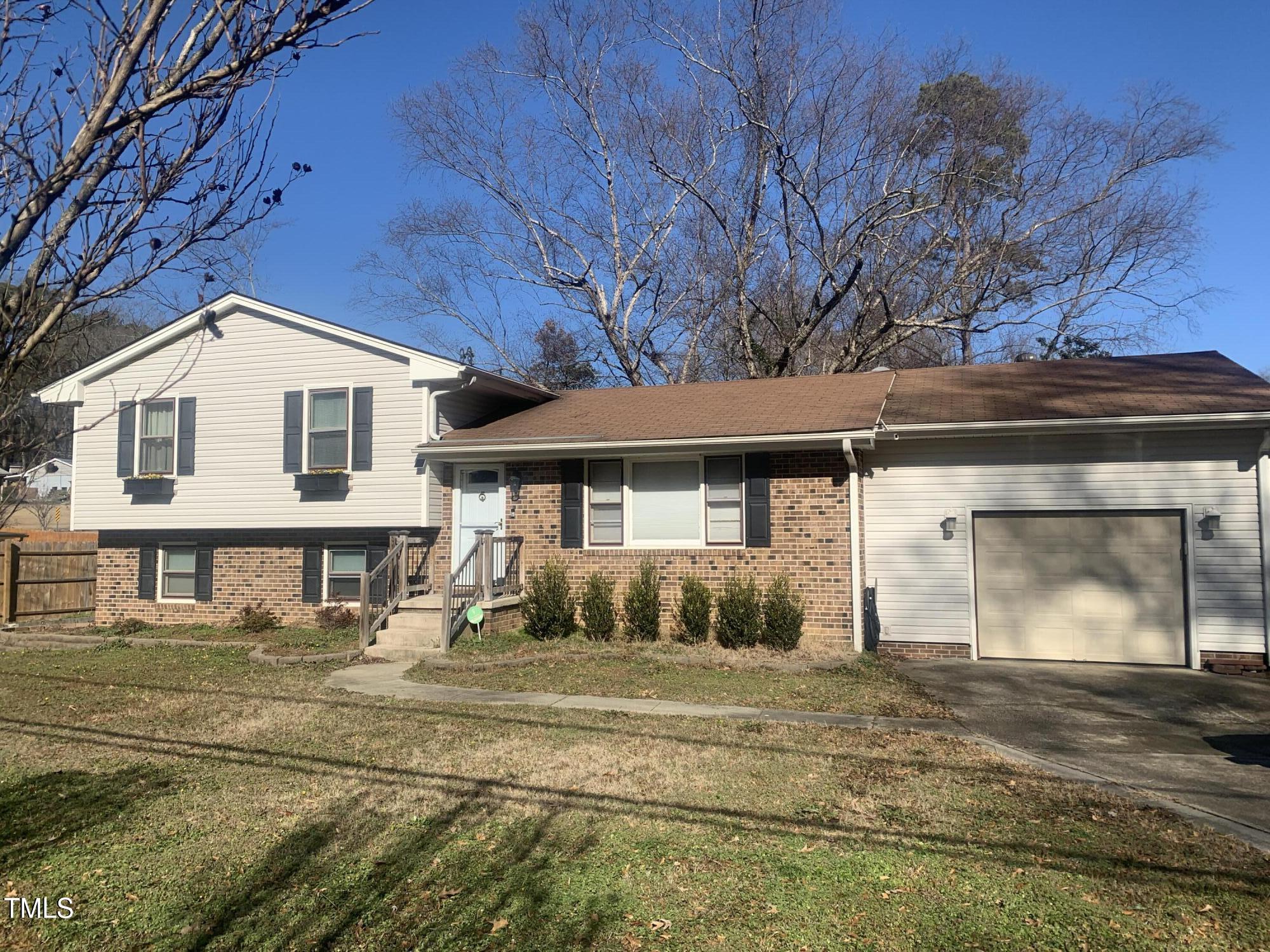 3305 Ingram Drive Raleigh, NC 27604 - Photo 2 of 7 a front view of a house with a yard