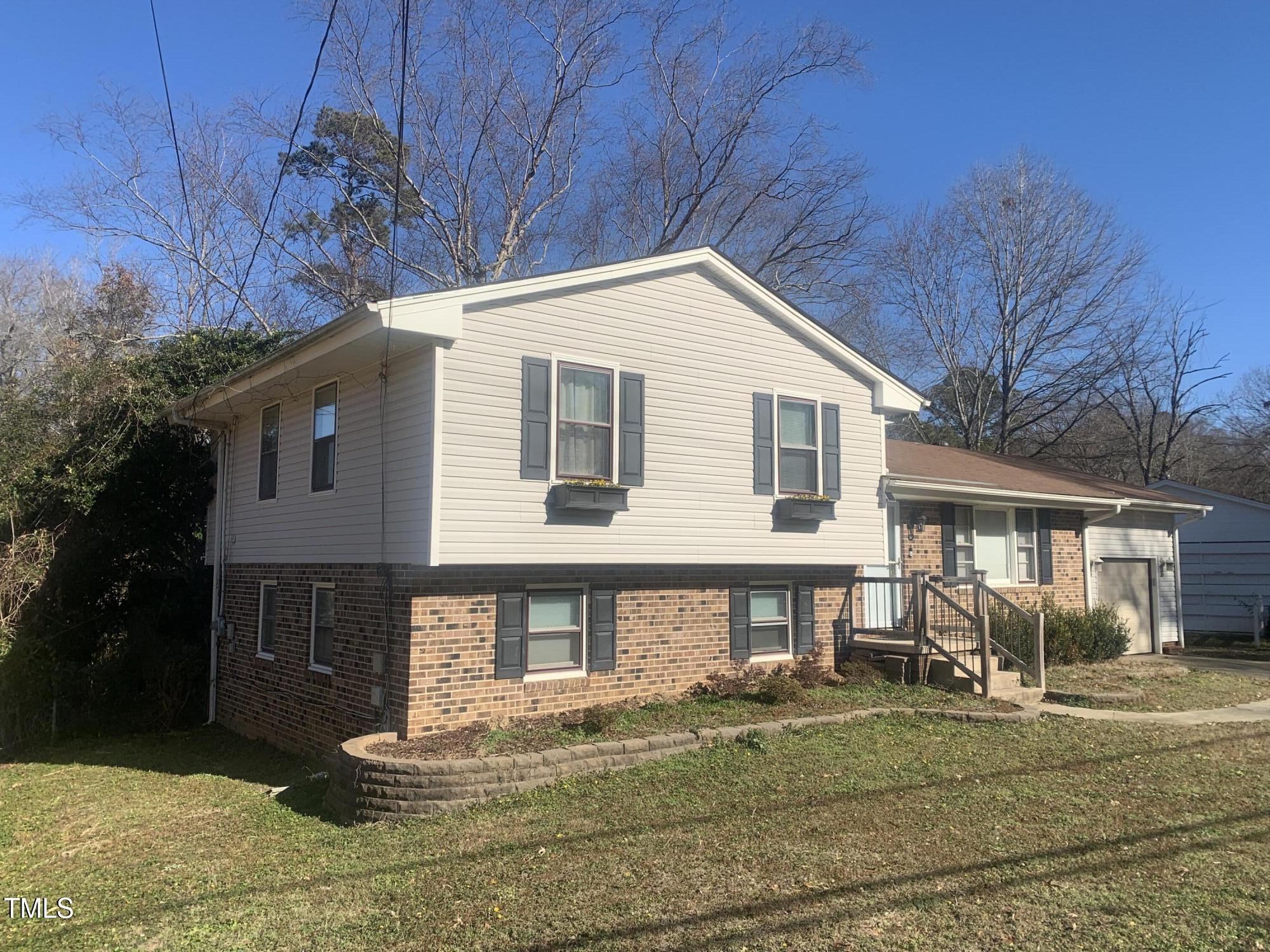 3305 Ingram Drive Raleigh, NC 27604 - Photo 3 of 7 a front view of a house with garden