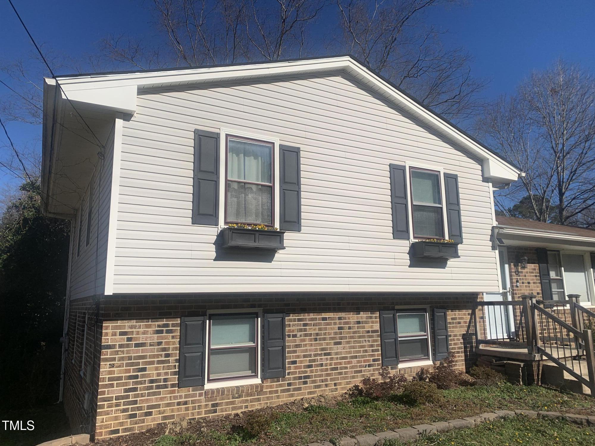 3305 Ingram Drive Raleigh, NC 27604 - Photo 4 of 7 a view of a house with more windows and plants