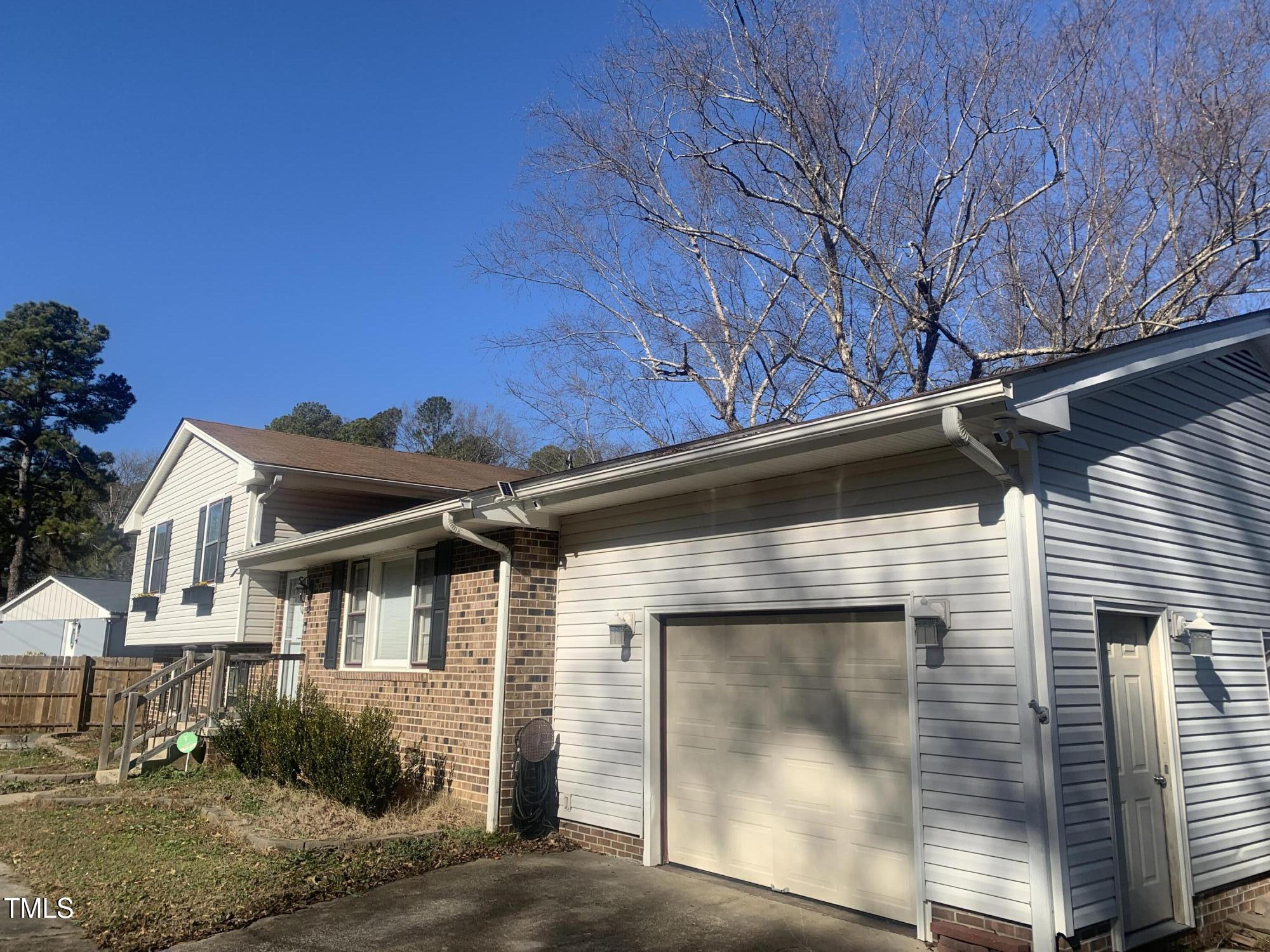 3305 Ingram Drive Raleigh, NC 27604 - Photo 6 of 7 a front view of a house with a yard