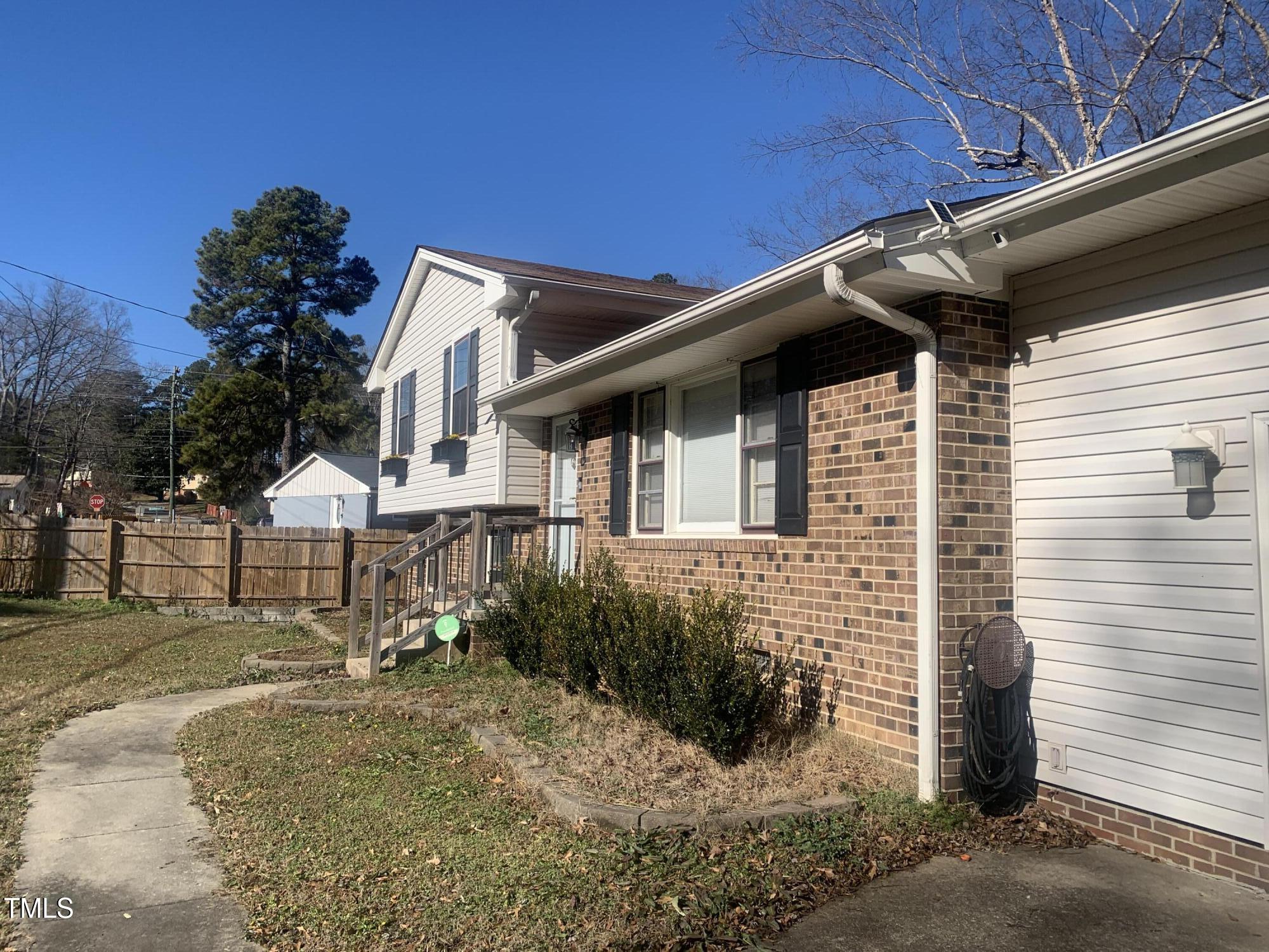 3305 Ingram Drive Raleigh, NC 27604 - Photo 7 of 7 a front view of a house with a yard