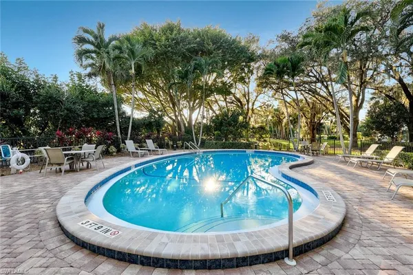 a view of swimming pool having outdoor seating