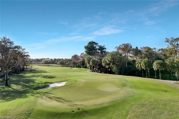 a view of a golf course with a lake