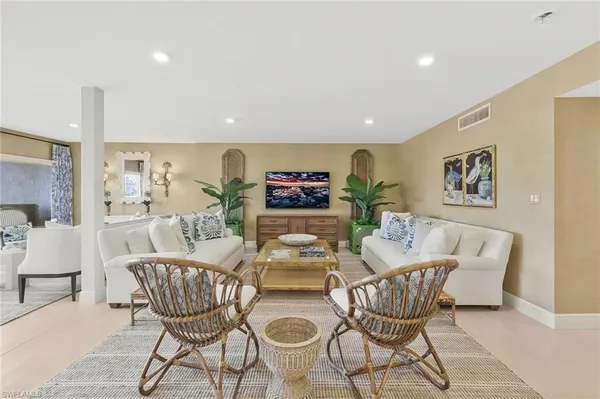 a dining room with furniture and wooden floor