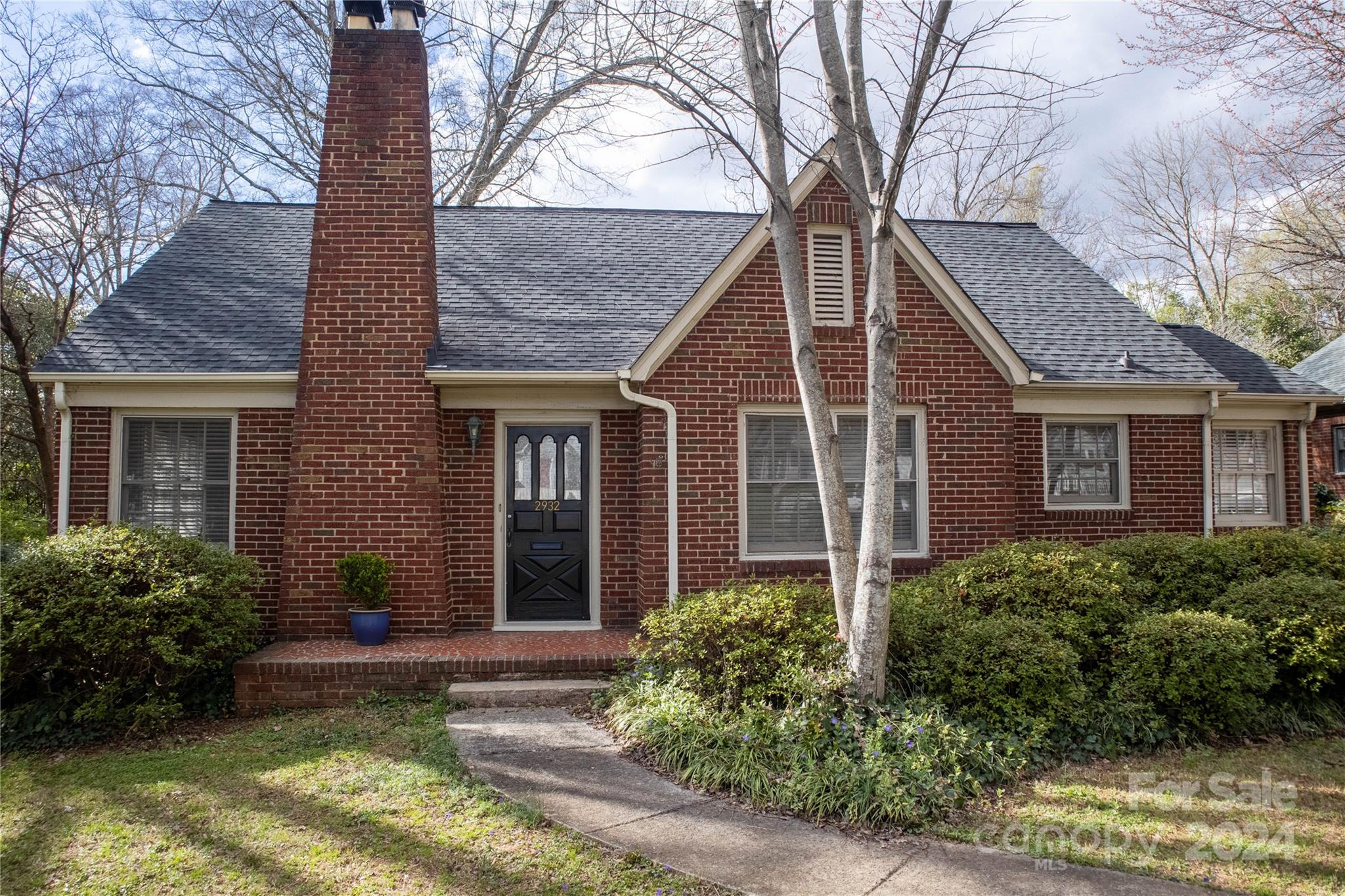 2932 Park Road Charlotte, NC 28209 - Photo 1 of 17 a front view of a house with garden
