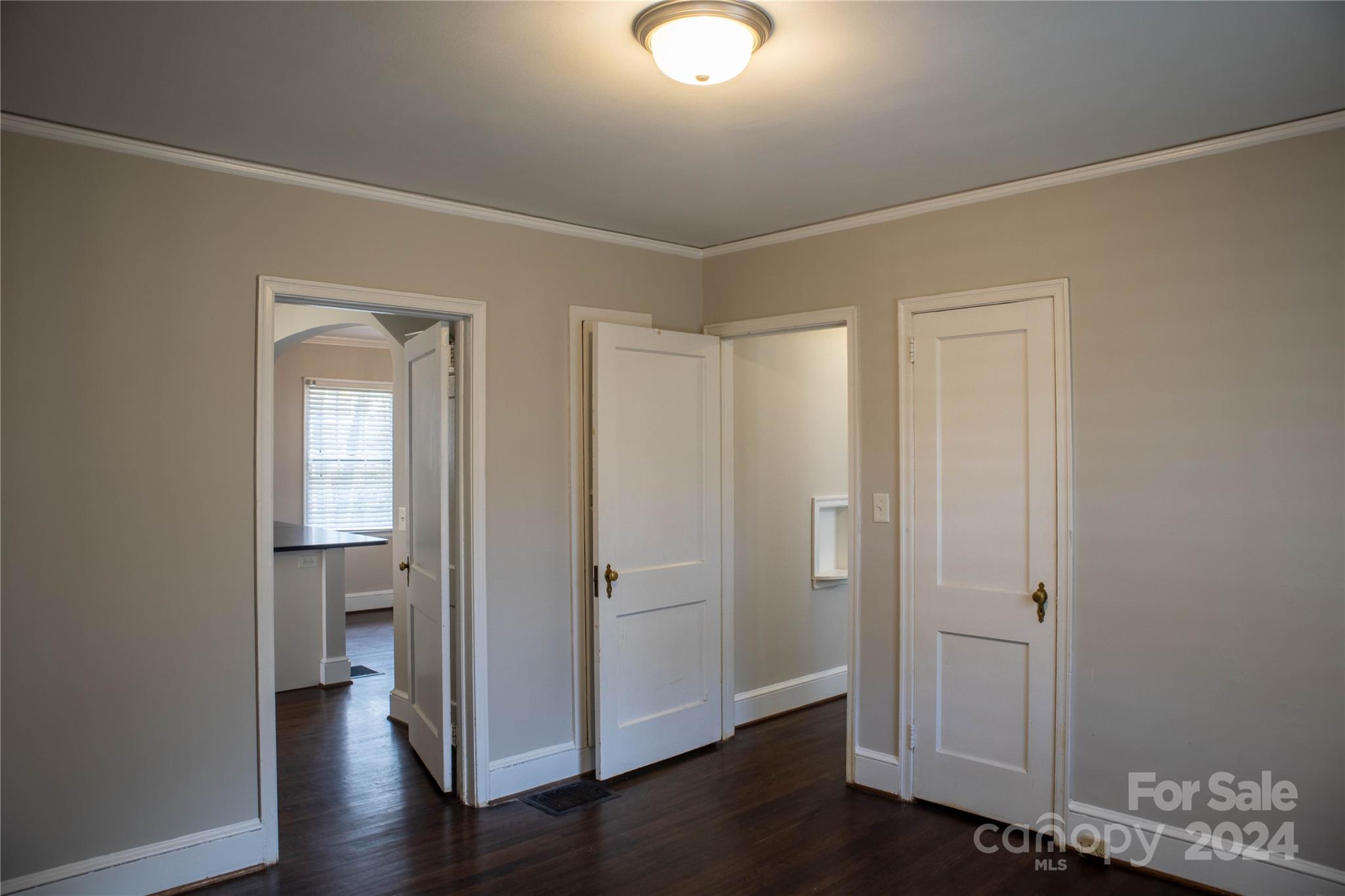 2932 Park Road Charlotte, NC 28209 - Photo 11 of 17 an empty room with wooden floor and a window