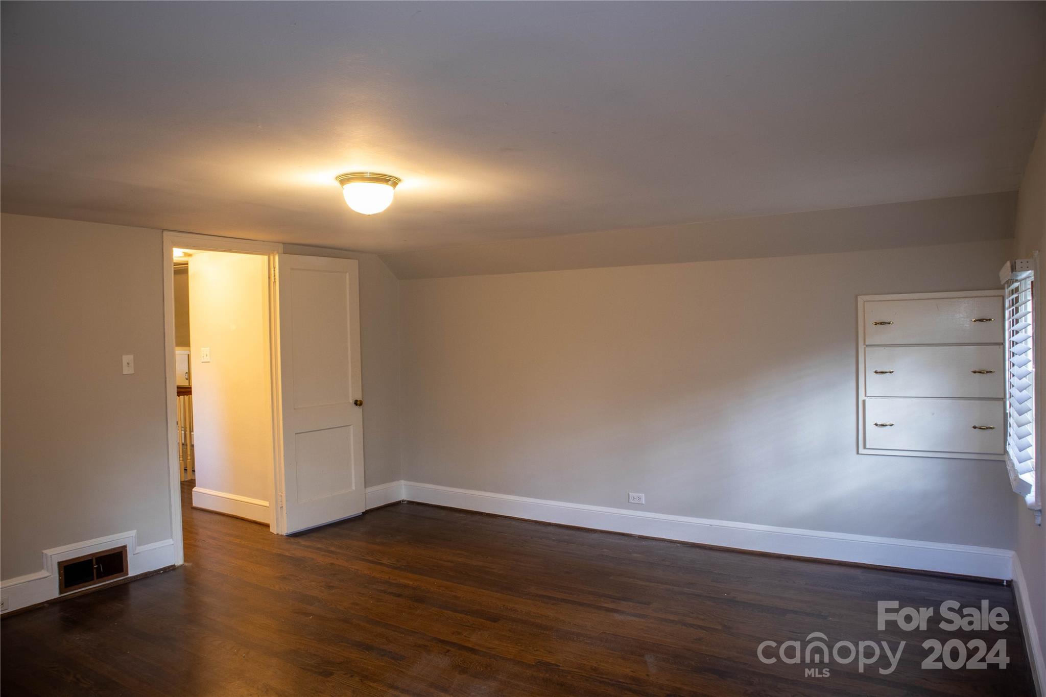 2932 Park Road Charlotte, NC 28209 - Photo 12 of 17 a view of an empty room with wooden floor
