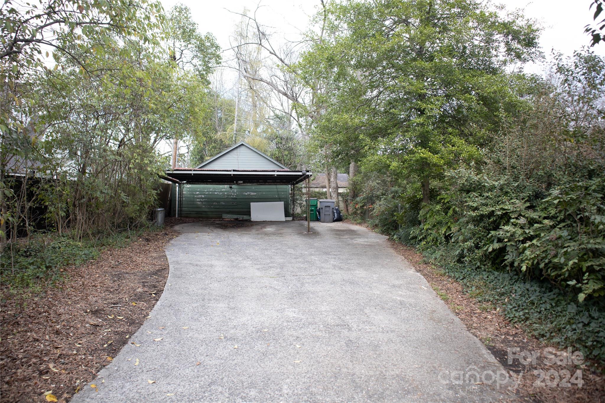 2932 Park Road Charlotte, NC 28209 - Photo 17 of 17 a backyard of a house with table and chairs